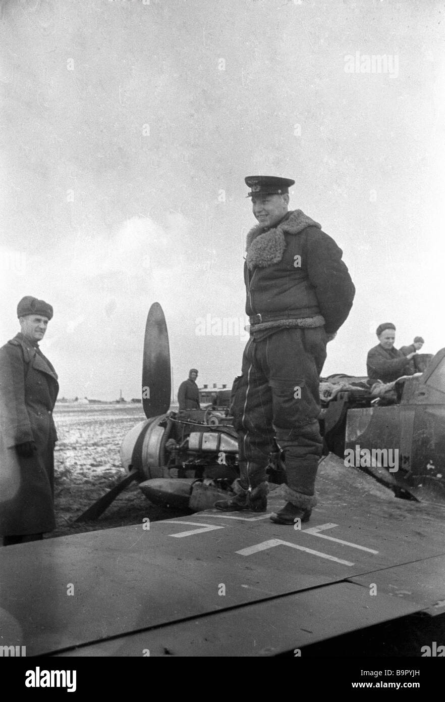 Glorious Soviet pilot A Pokryshkin standing on a downed Nazi plane ...