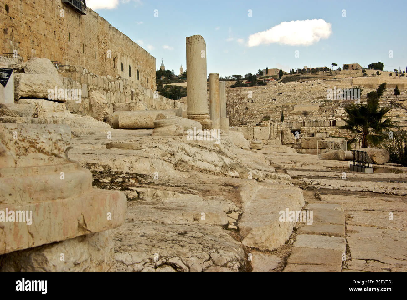 Original worn steps to Hulda Gate of Temple Mount and fallen colonnades in excavation site Jerusalem Archaeological Park Stock Photo