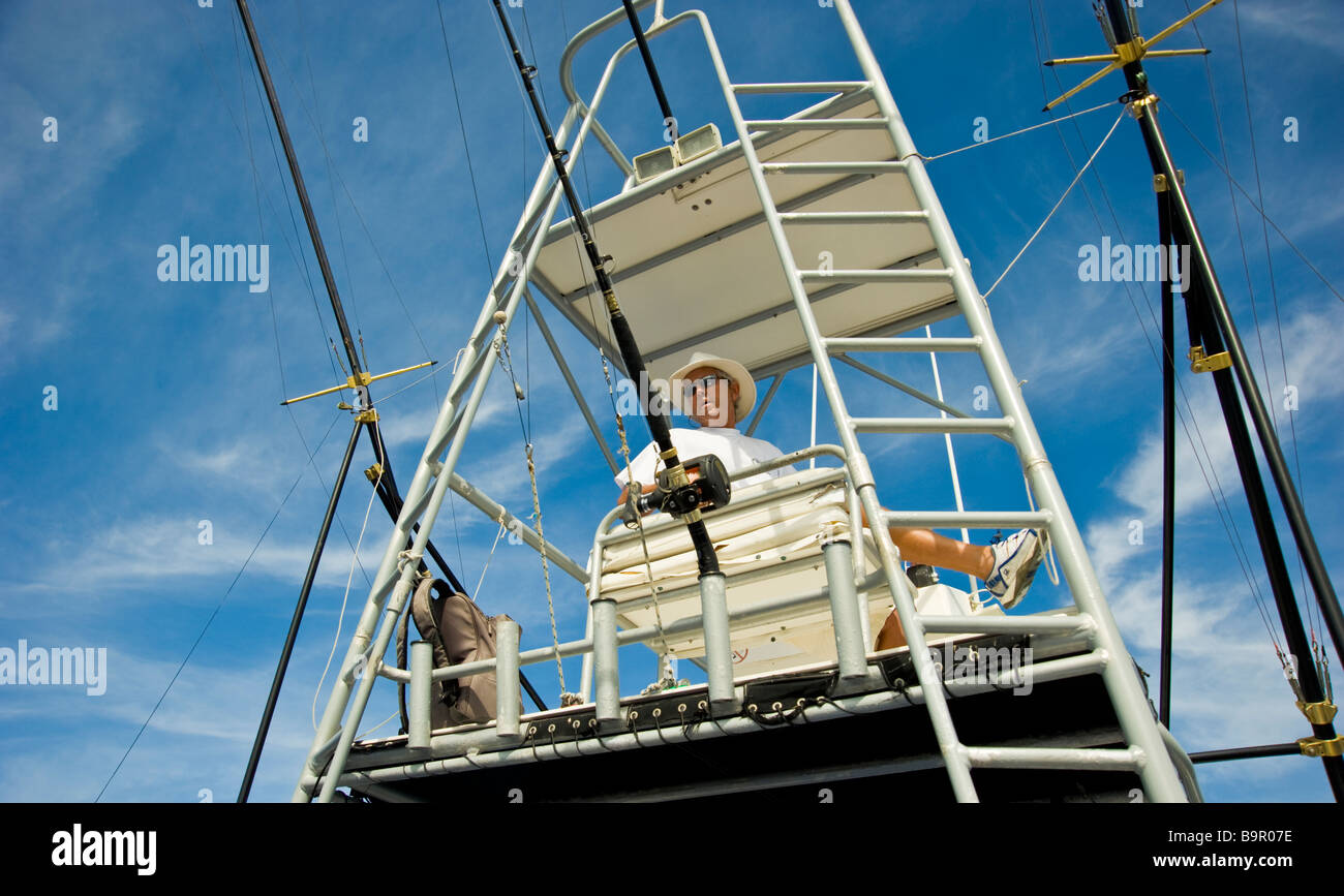 Big game fishing, fishermen on flybridge of fishing boat Saint Gilles La Réunion France | Fischer auf der Brücke, Angelboot Stock Photo