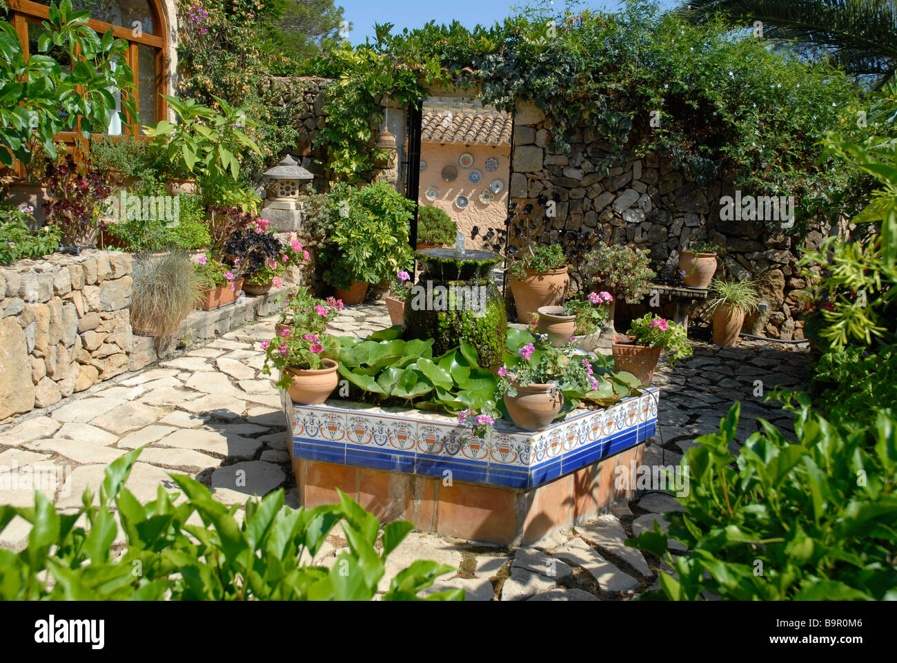 Spanish Courtyard Garden With Formal Pond And Water Feature Jesus
