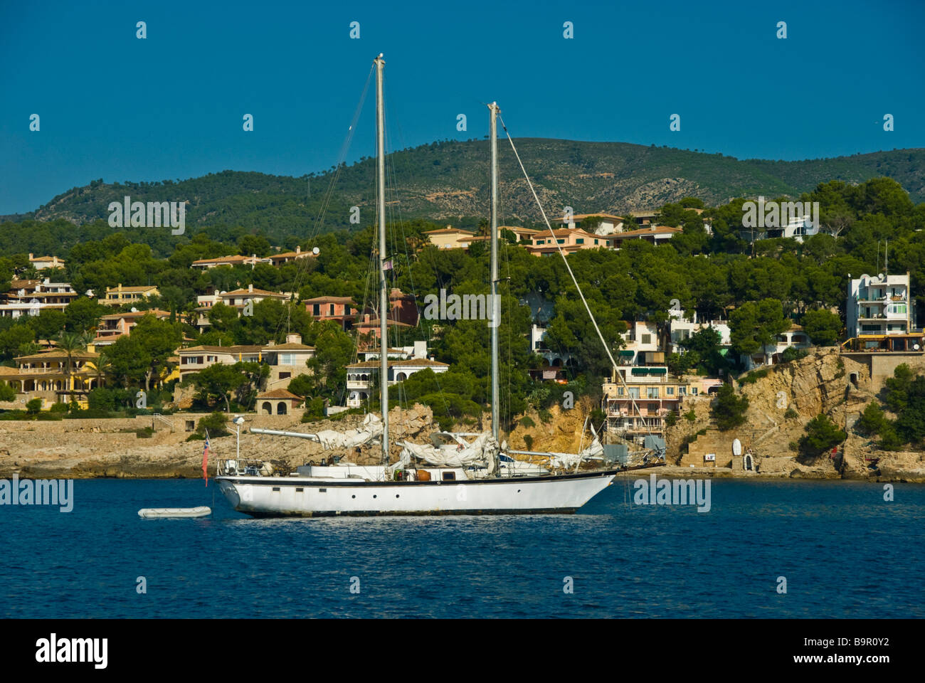 Sailing yacht anchoring, Majorca Balearic Islands Spain | Segelyacht ankert in einer Bucht Mallorca Balearen Spanien Stock Photo