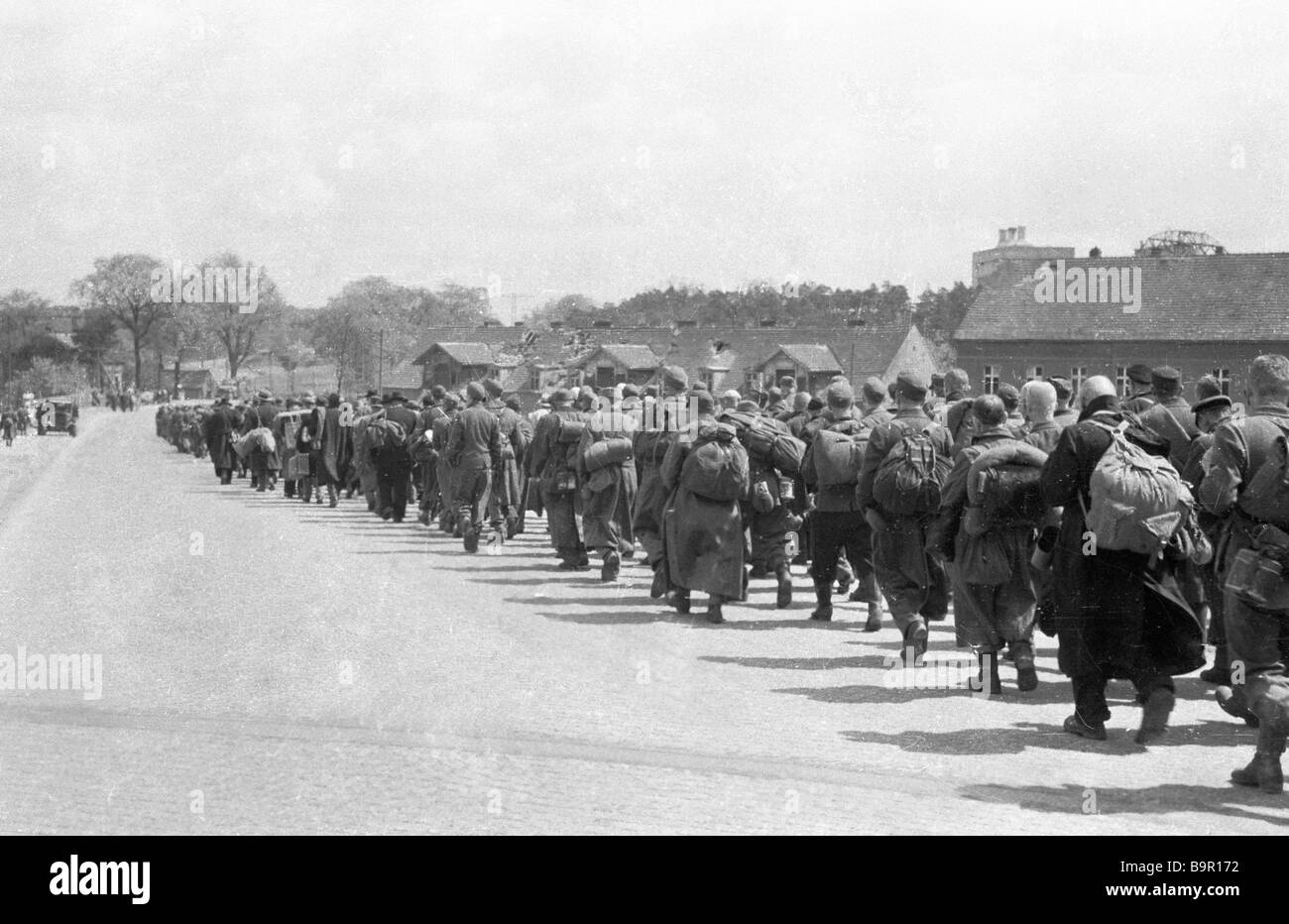 Surrendered Nazi units passing through a village Stock Photo - Alamy