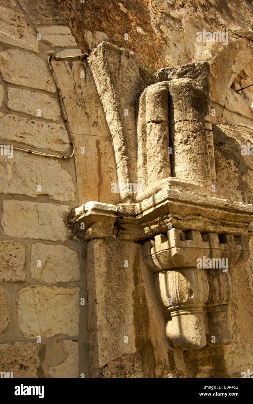 Sculpted limestone decoration on walls in courtyard of Church of the Holy Sepulchre Stock Photo