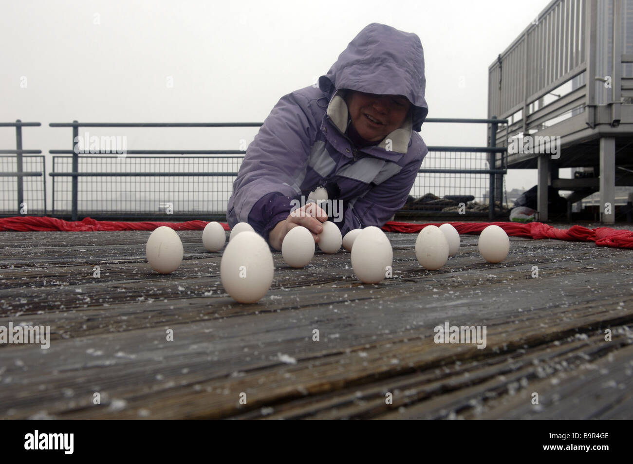 People the spring equinox by standing eggs on end Stock Photo