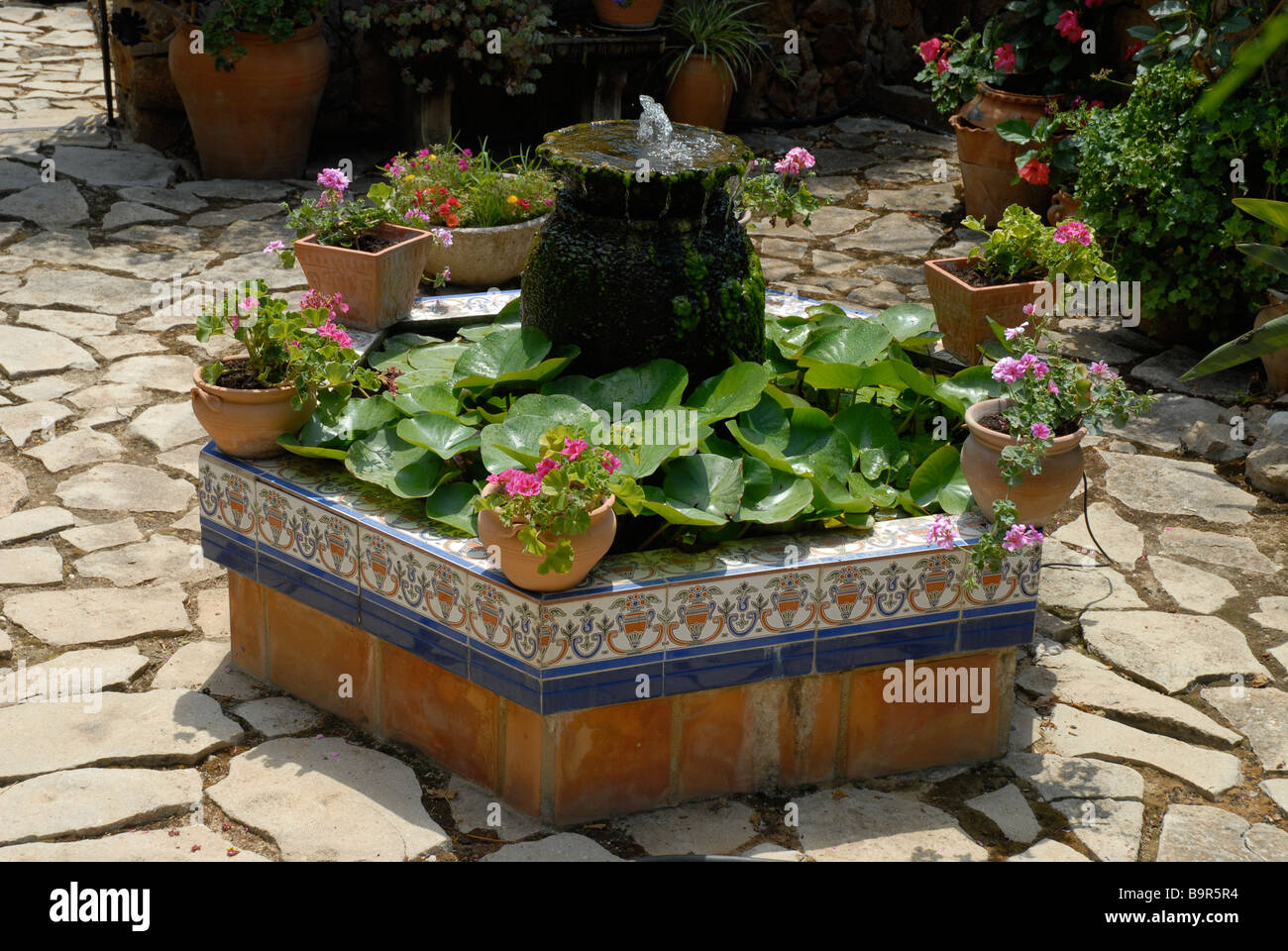 small pond and fountain in typical Spanish courtyard garden, Jesus