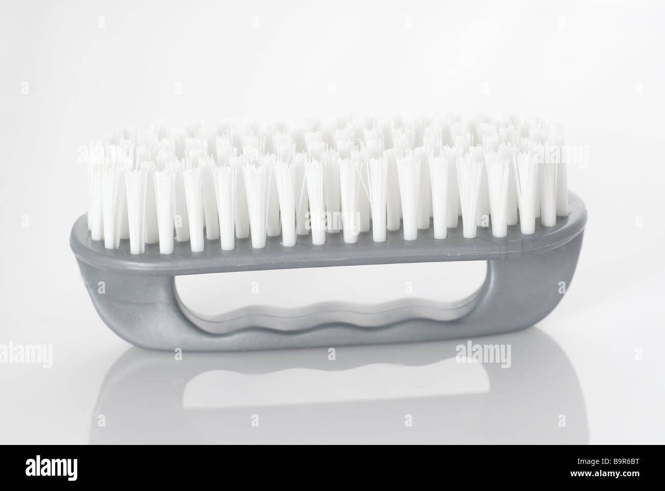 Cleaning brush against a white background Stock Photo - Alamy