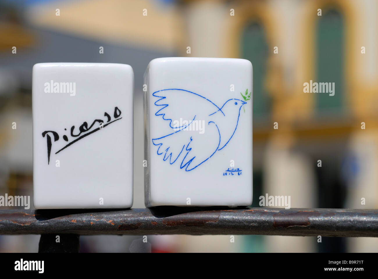 Souvenirs from Picasso Casa Natal, birth house in the background of the image. Ceramics Dove of Peace Stock Photo