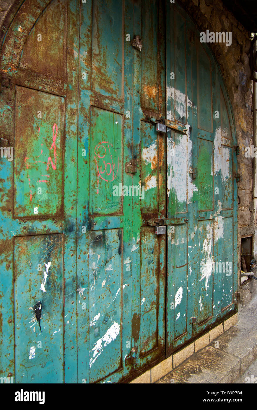 Locked rusted steel doors of a closed shop stall at Arab market in ...