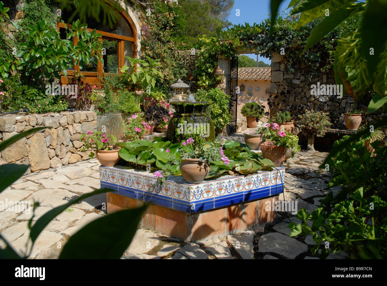 Spanish Courtyard Garden With Formal Pond And Water Feature Jesus