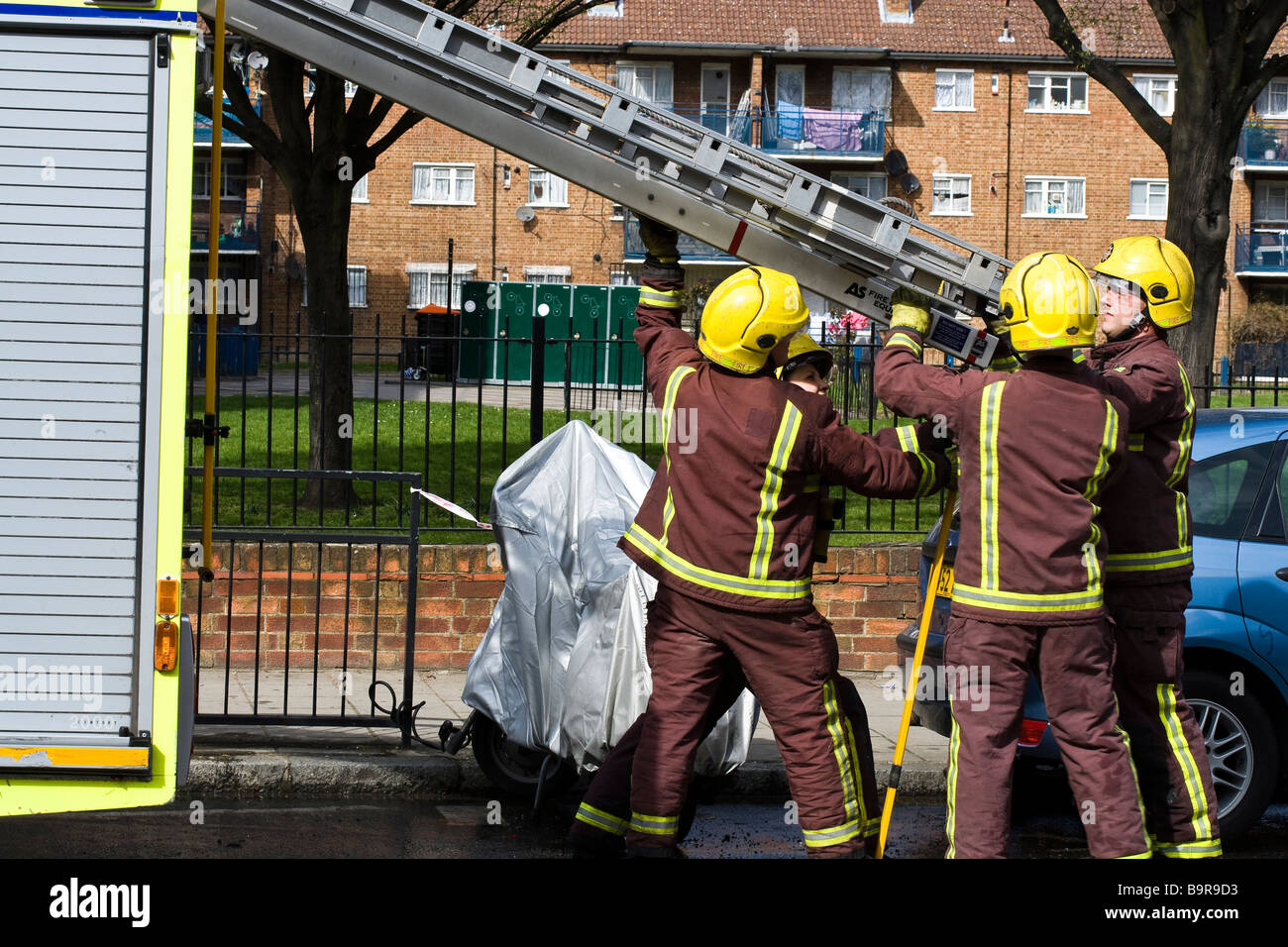 Ladder uk engine fire men fire woman Stock Photo