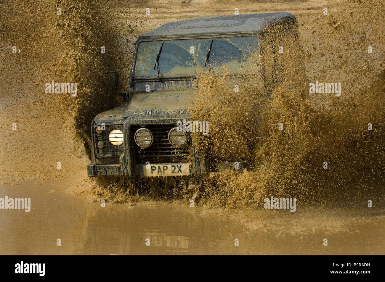 a-land-rover-splashes-across-a-flooded-r