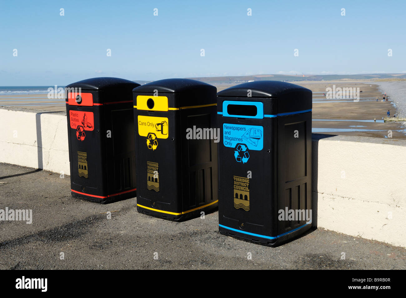 Recycling bins on the seafront of Westward Ho!, Devon, England. Stock Photo
