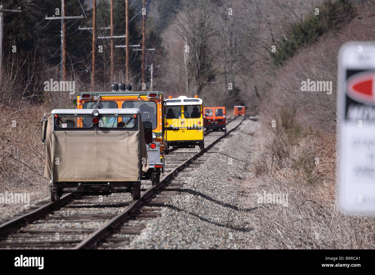 A group of different kinds of rail cars driving away down the railroad tracks in the Snoqualmie Valley. Land PH WP Stock Photo