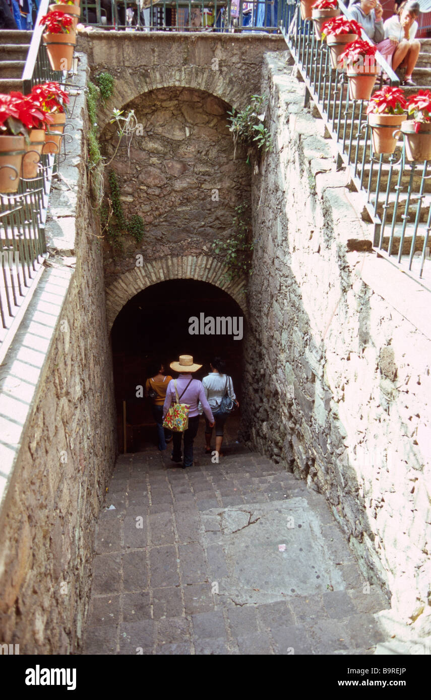 Three young Mexican women walking into the famous tunnels in the