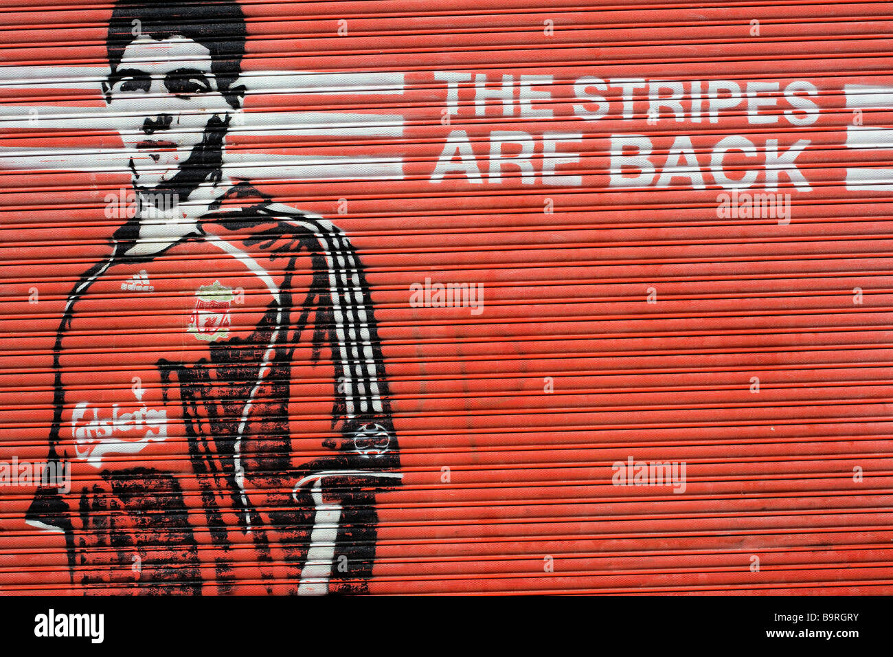 United Kingdom, Liverpool, football player painted on an iron curtain