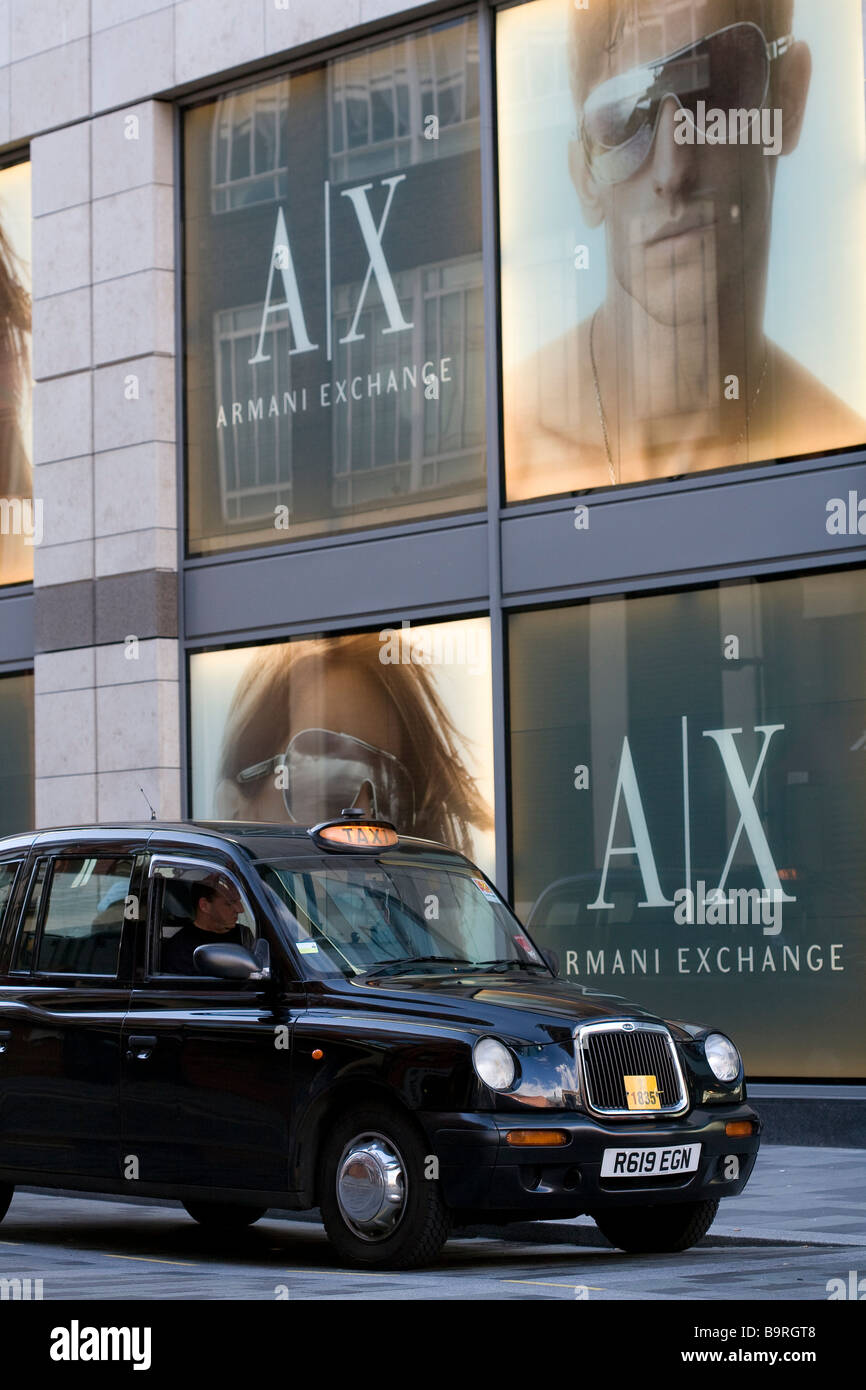 United Kingdom, Liverpool, The Met Quarter, cab in front of the Armani Exchange store Stock Photo