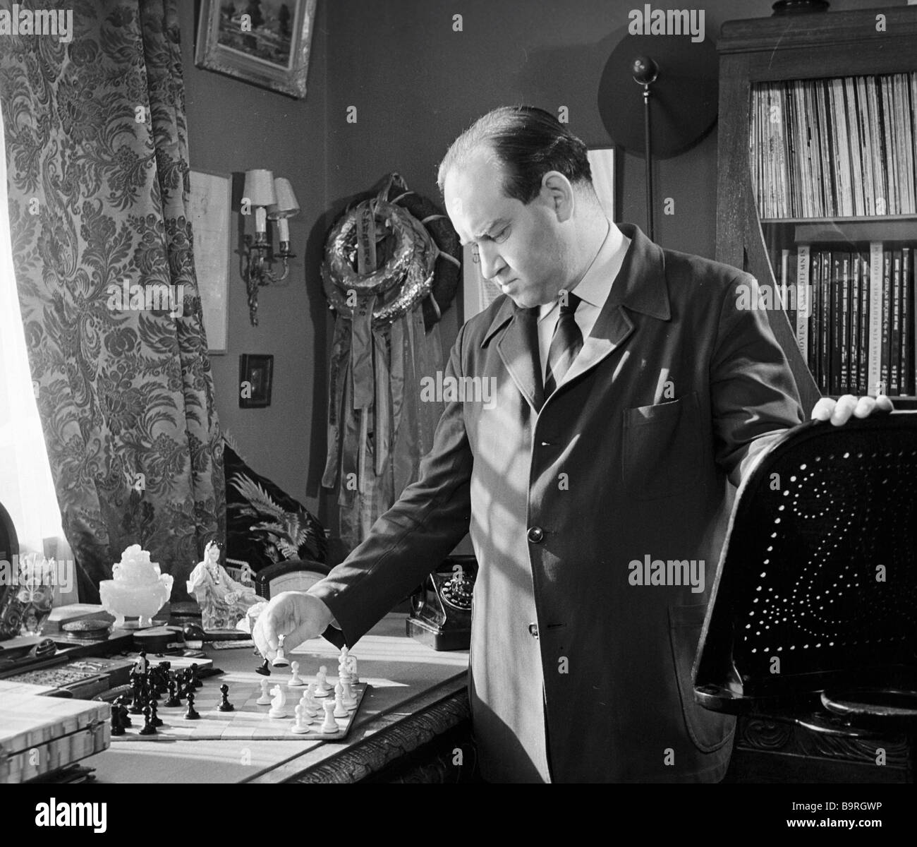 Violinist David Oistrakh People s Artist of the USSR solving a chess