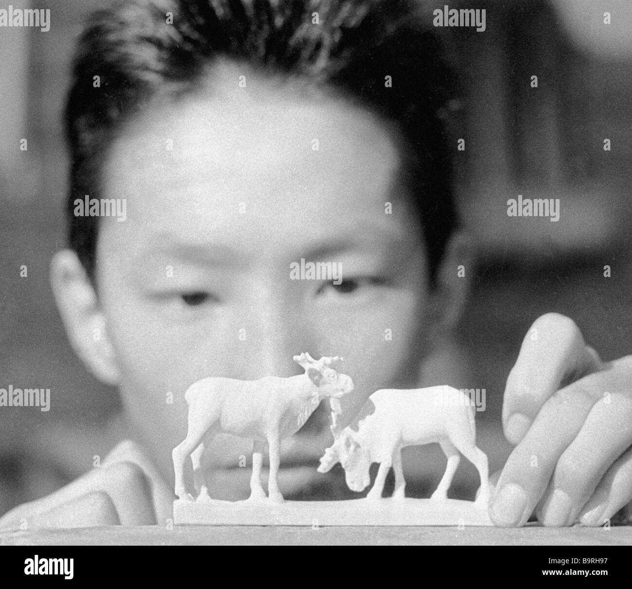 Young ivory carver Stock Photo Alamy