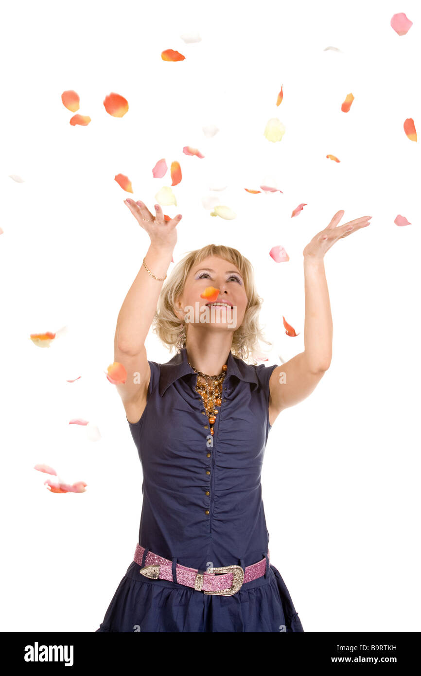 The young woman throws up upwards flower petals Stock Photo Alamy