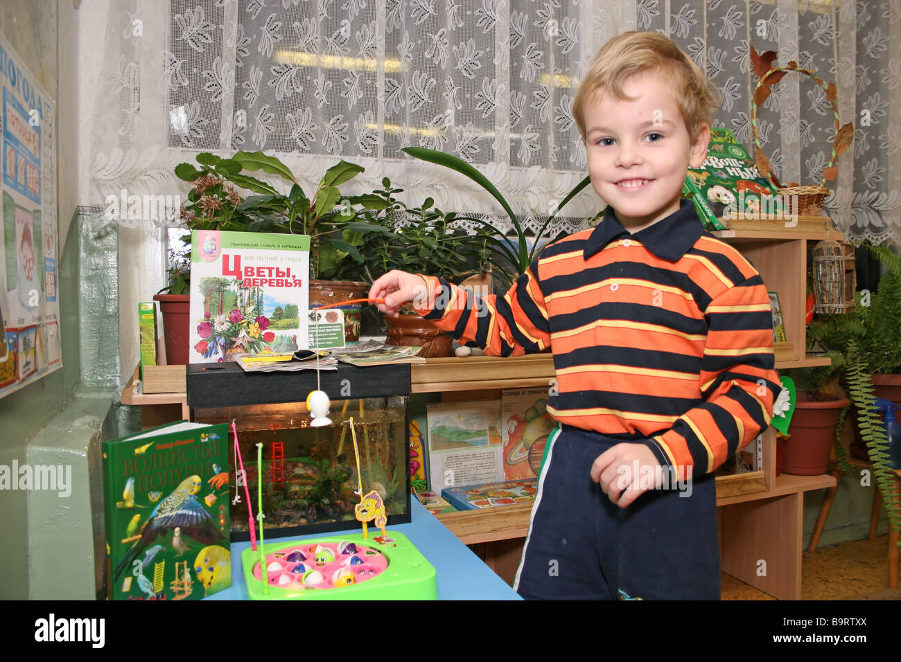 child in kindergarten fishing Stock Photo - Alamy