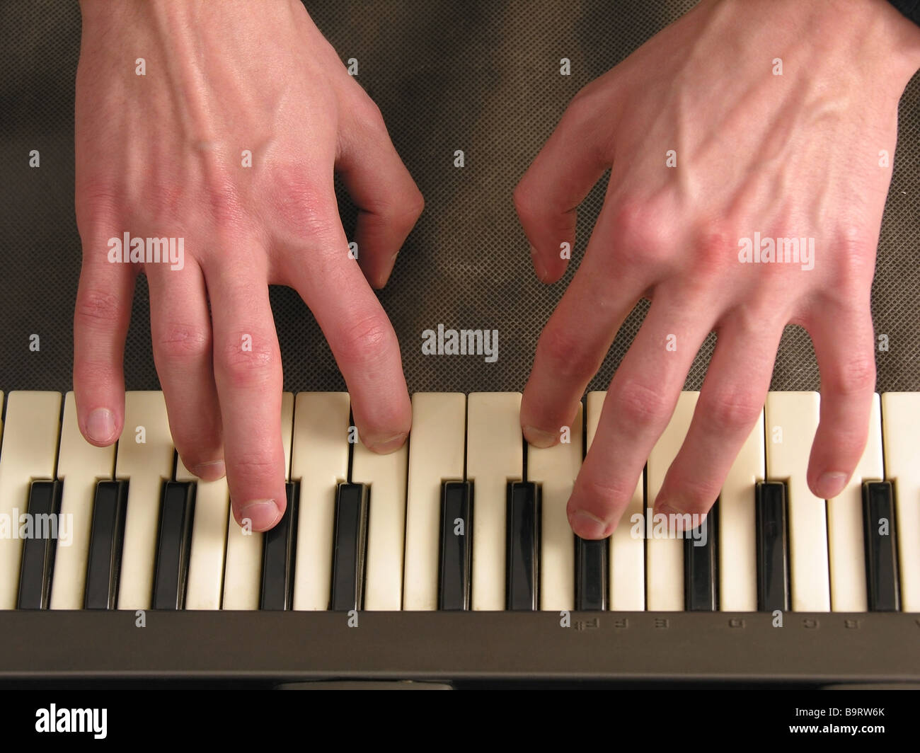 hands on piano Stock Photo Alamy