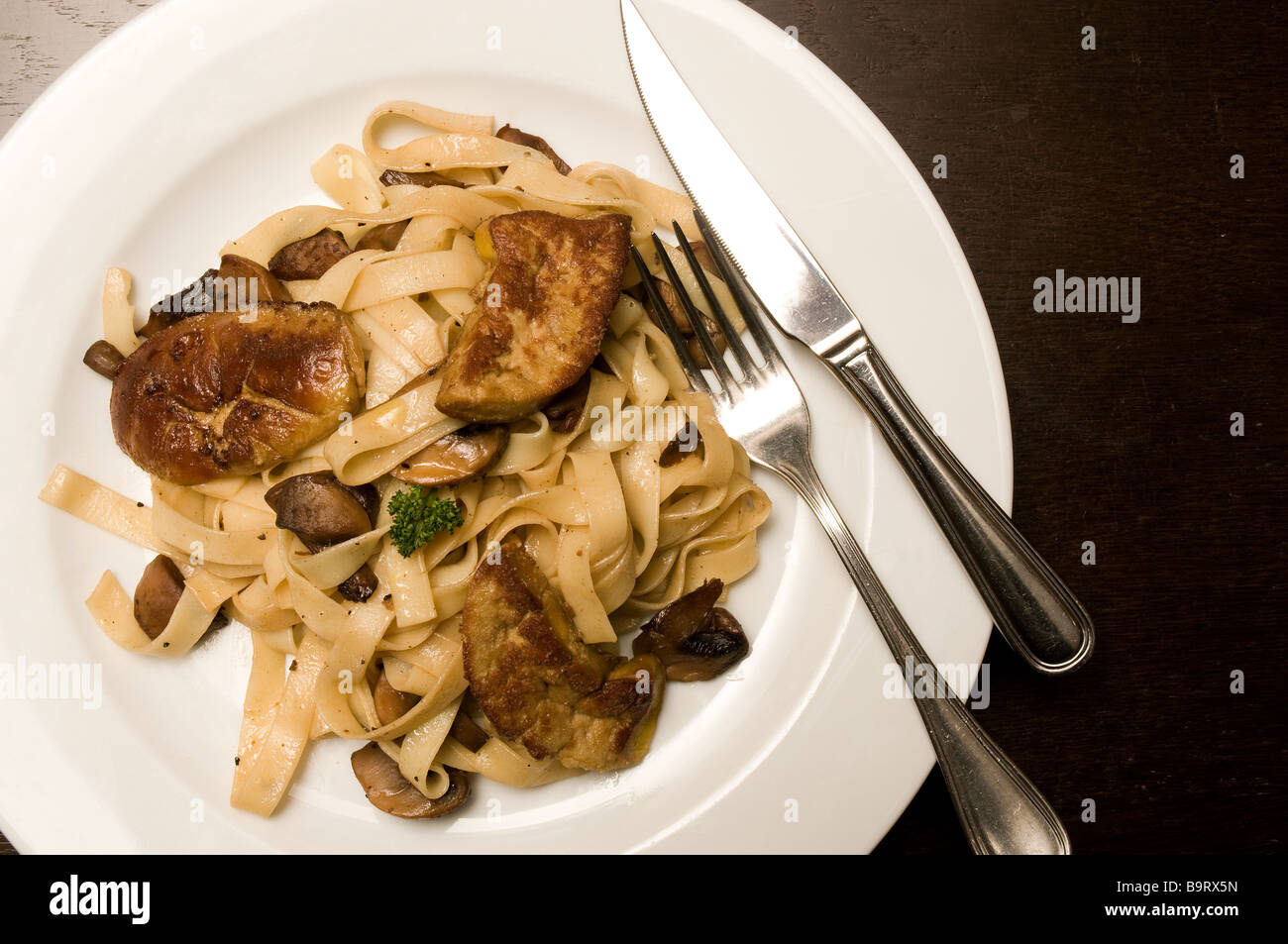 At Toulouse's Le Bon Vivre restaurant - delicious pan fried foie gras and tagliatellis Stock Photo