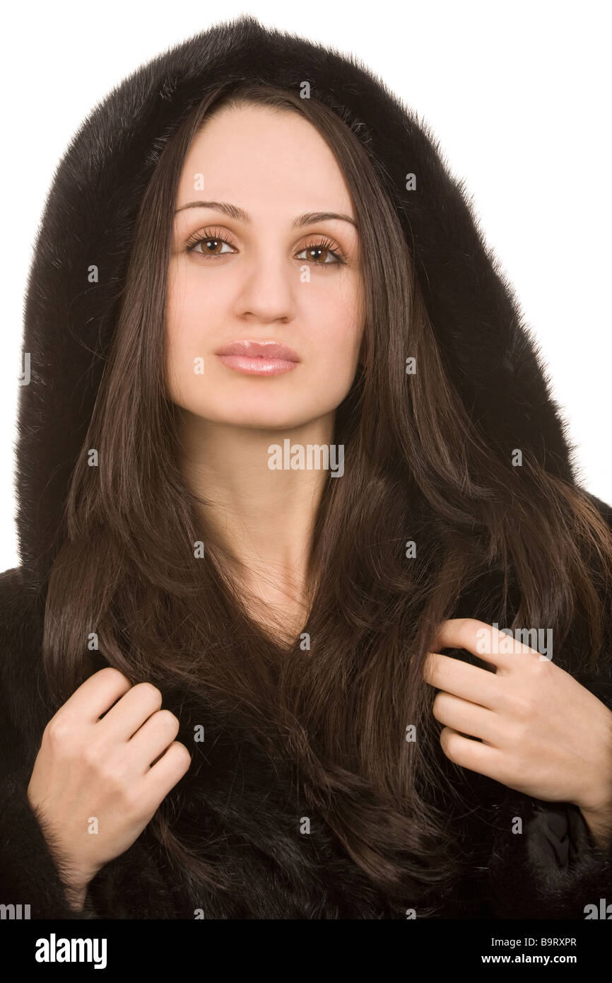 young woman in fur coat on white background Stock Photo - Alamy