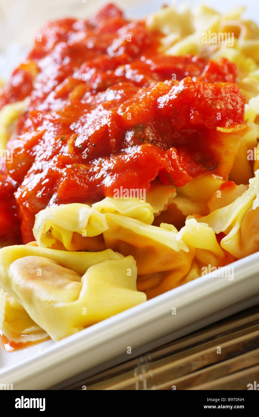 prepared tortellini with chunky vegetable tomato sauce Stock Photo