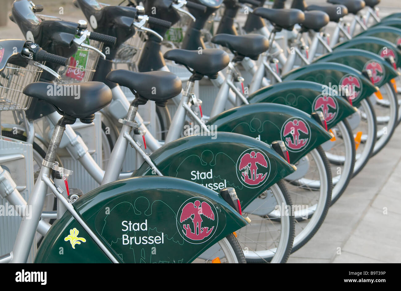 Public bicycles provided by the Brussels-Capital Region and City of Brussels wait in a docking station in Brussels, Belgium. Stock Photo