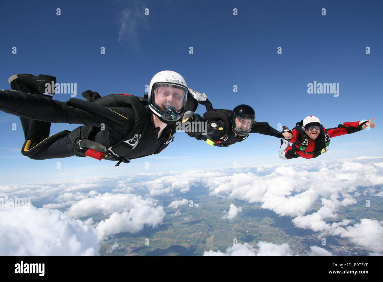 Three Skydivers In Freefall Stock Photo - Alamy