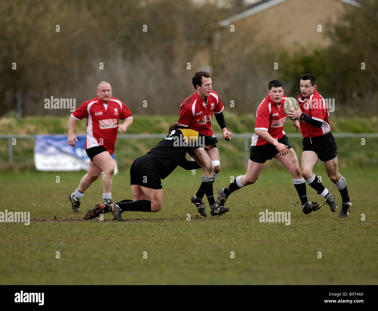 rugby player being tackled Stock Photo