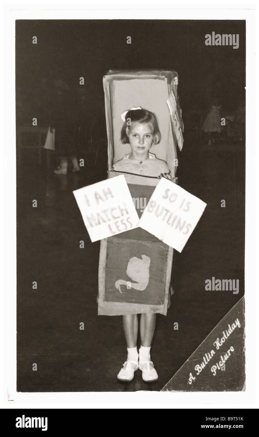Young girl in fancy dress costume at Butlins in 1950's. The costume placard says ' I am matchless so is Butlins' Stock Photo