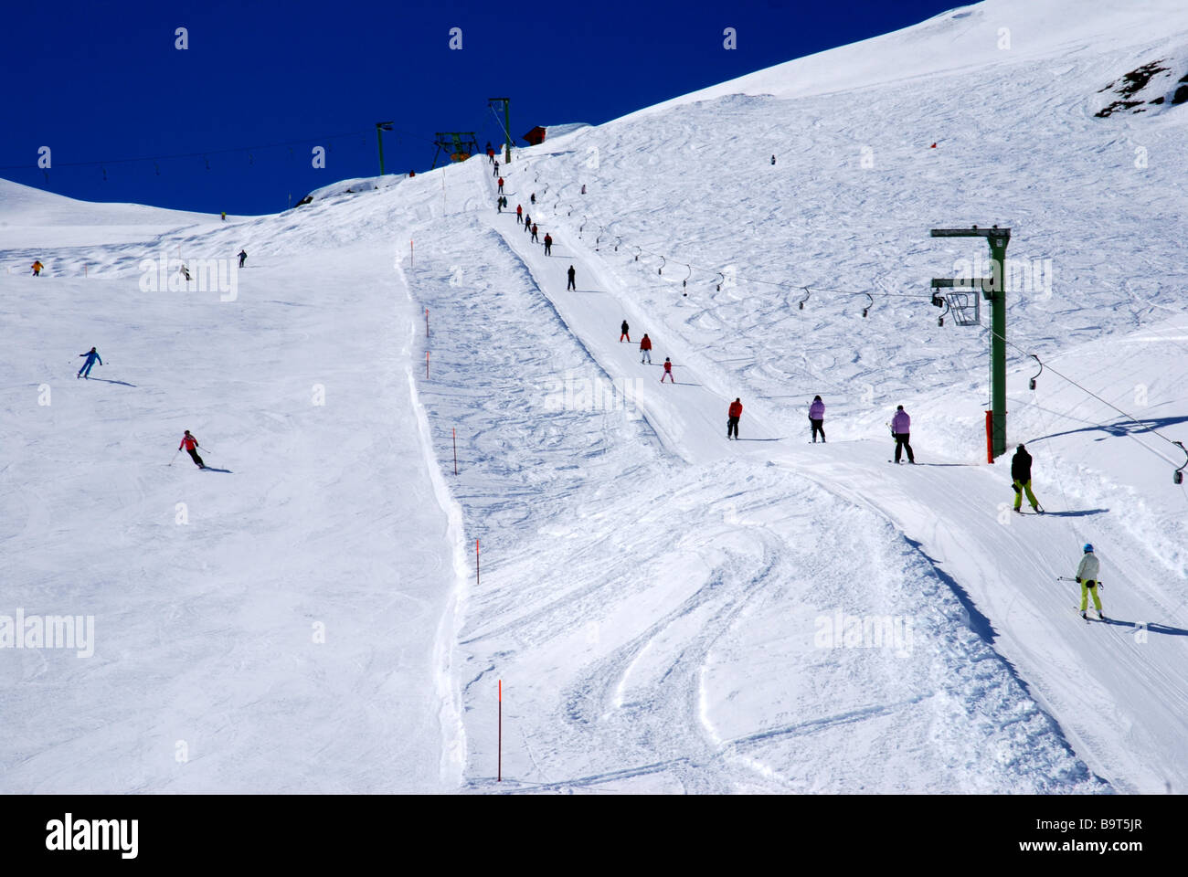Skiers on Skitow and skislopes at Zinal Val d Anniviers Valais Wallis alps Switzerland Stock Photo