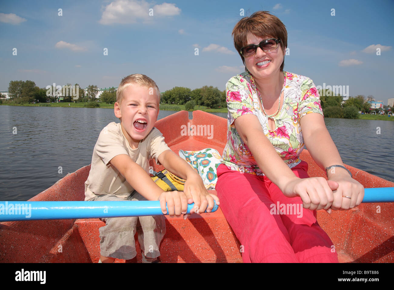 Boy in paddle boat hi-res stock photography and images - Alamy