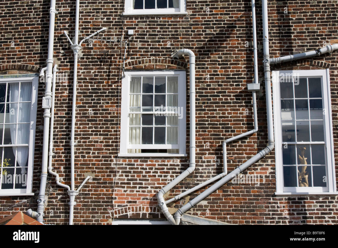 complicated drain pipes weymouth seaside town dorset england uk gb Stock Photo