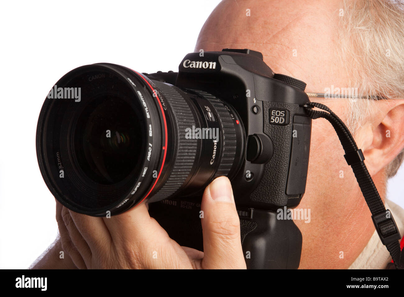 Photography man using Canon 50d digital slr camera Stock Photo