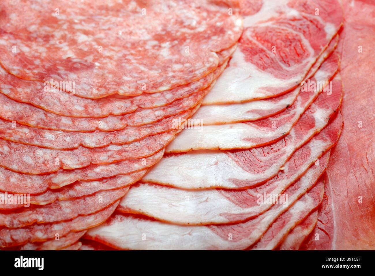 Macro picture of slices of salami Stock Photo Alamy