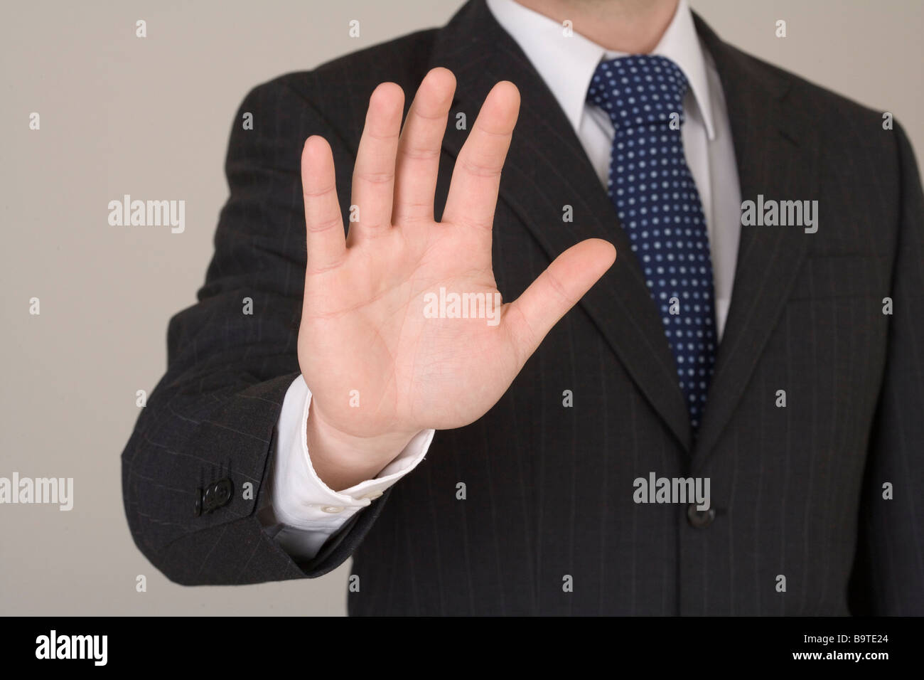 Businessman with self defending gesture Stock Photo