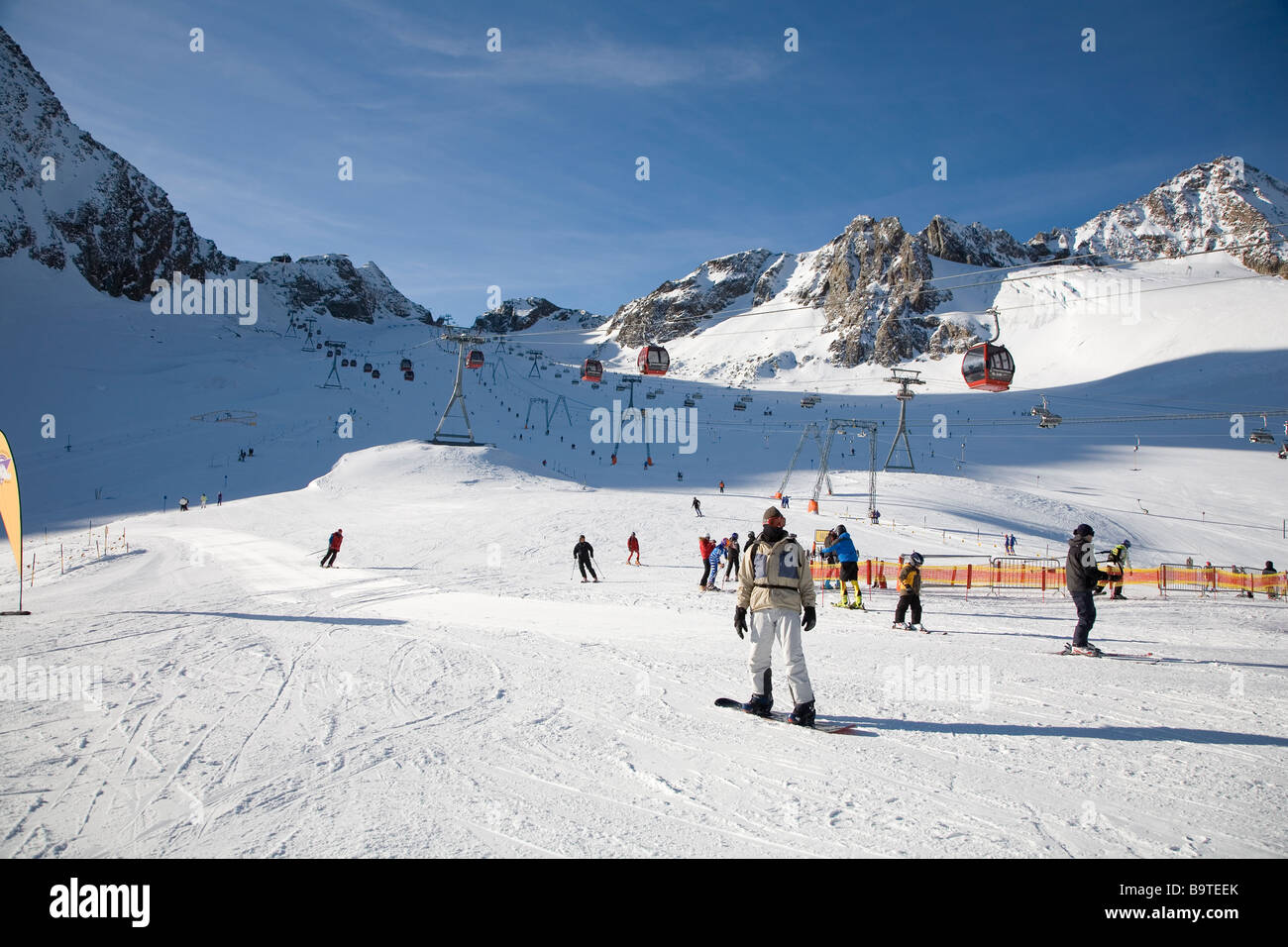 The Stubaier Gletscher Near Innsbruck Austria Stubaier Glacier Snowboarder in the foreground Stock Photo