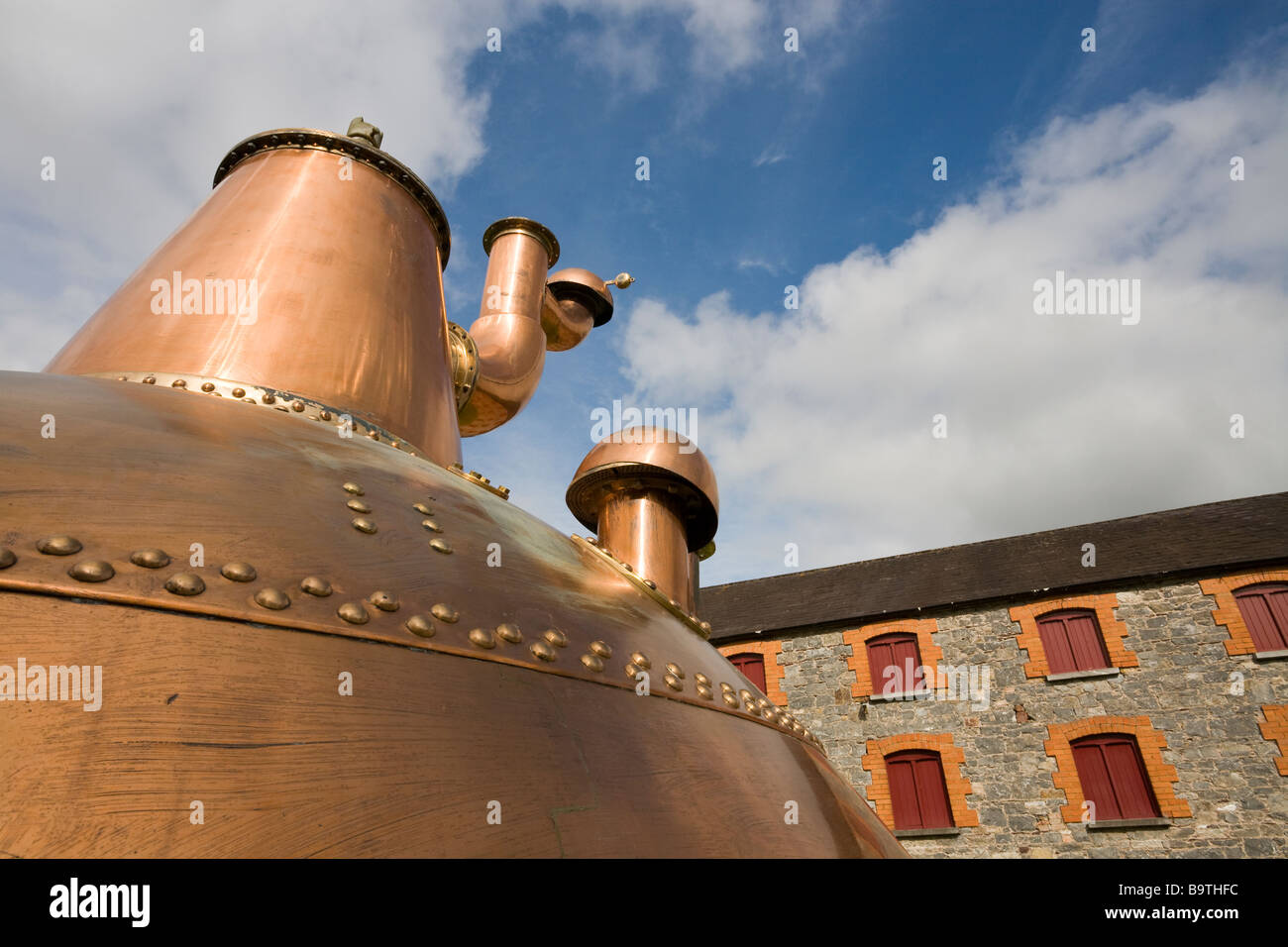 Copper Distilling Kettle. An old massive copper mash cooker is on