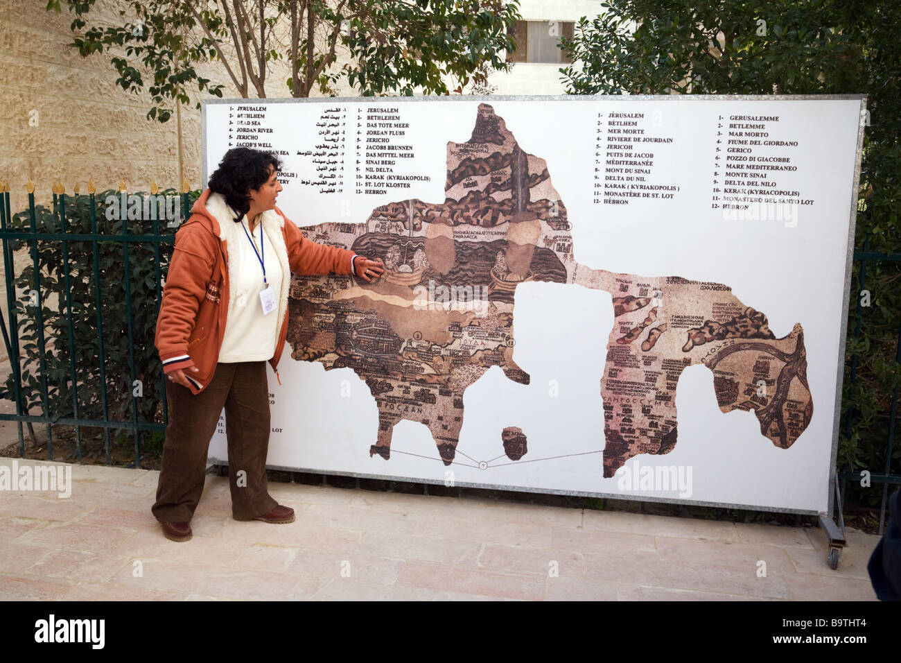 A local guide describing the mosaic map of the Holy Land, Madaba, Jordan Stock Photo