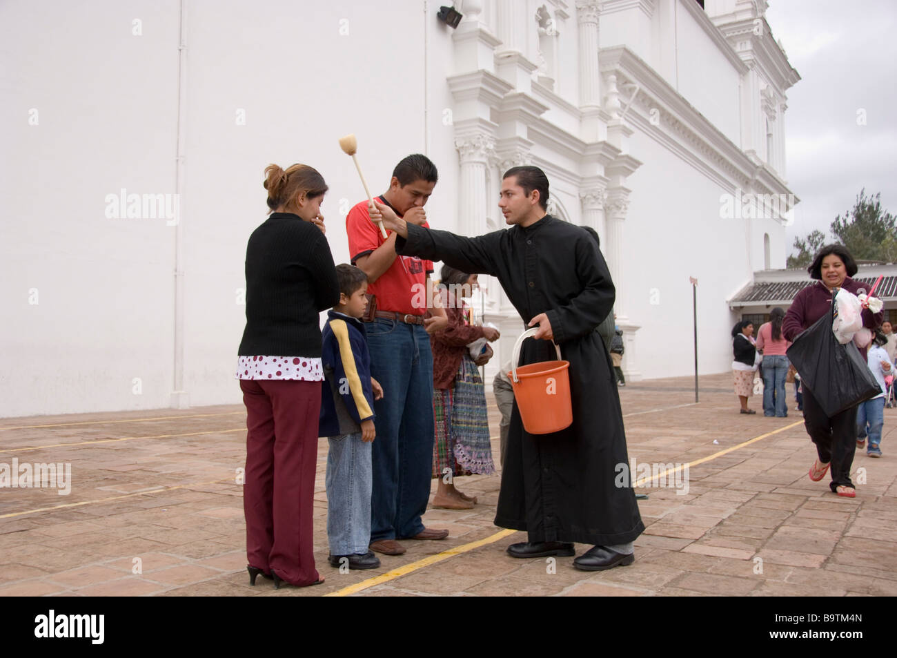 Vicar blessing pilgrims in front of the Basilica of Esquipulas, Guatemala Stock Photo