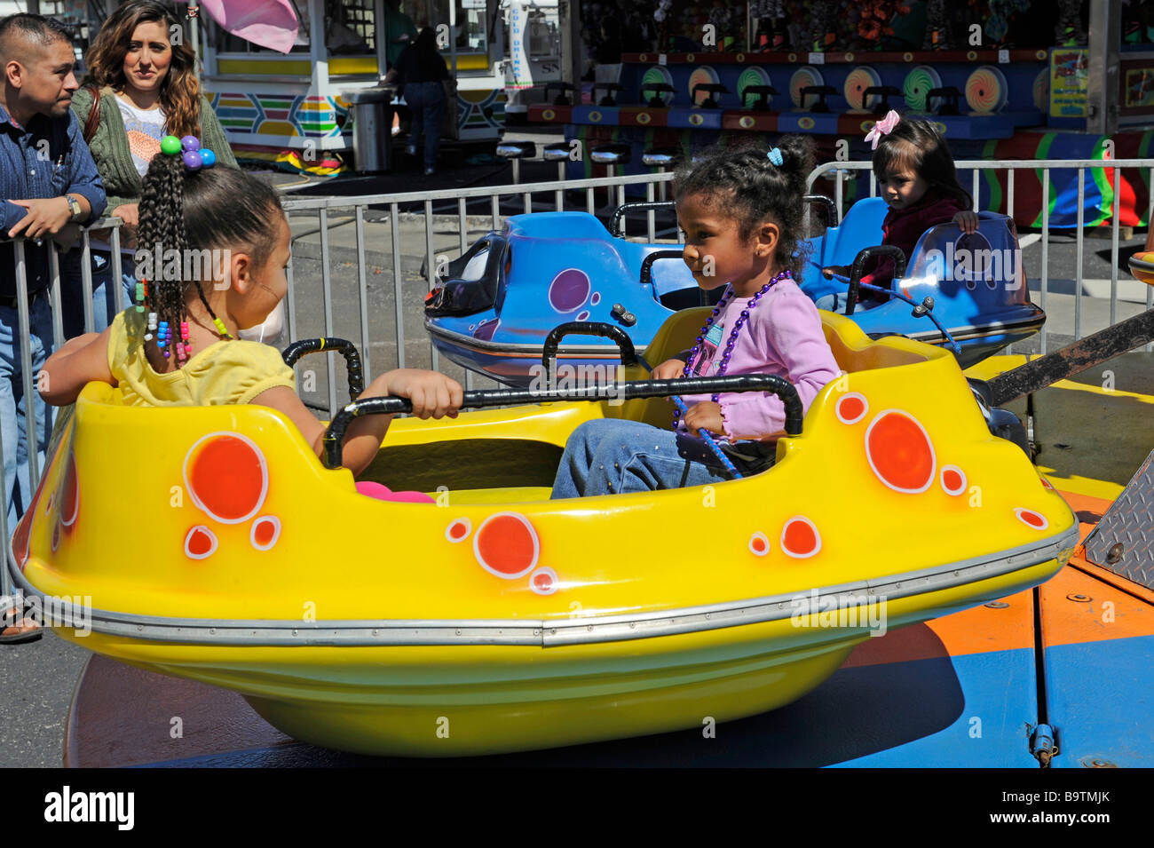 Ethnic Children on Midway Rides at Mardi Gras Celebration in Lake Wales  Florida Central USA Stock Photo - Alamy