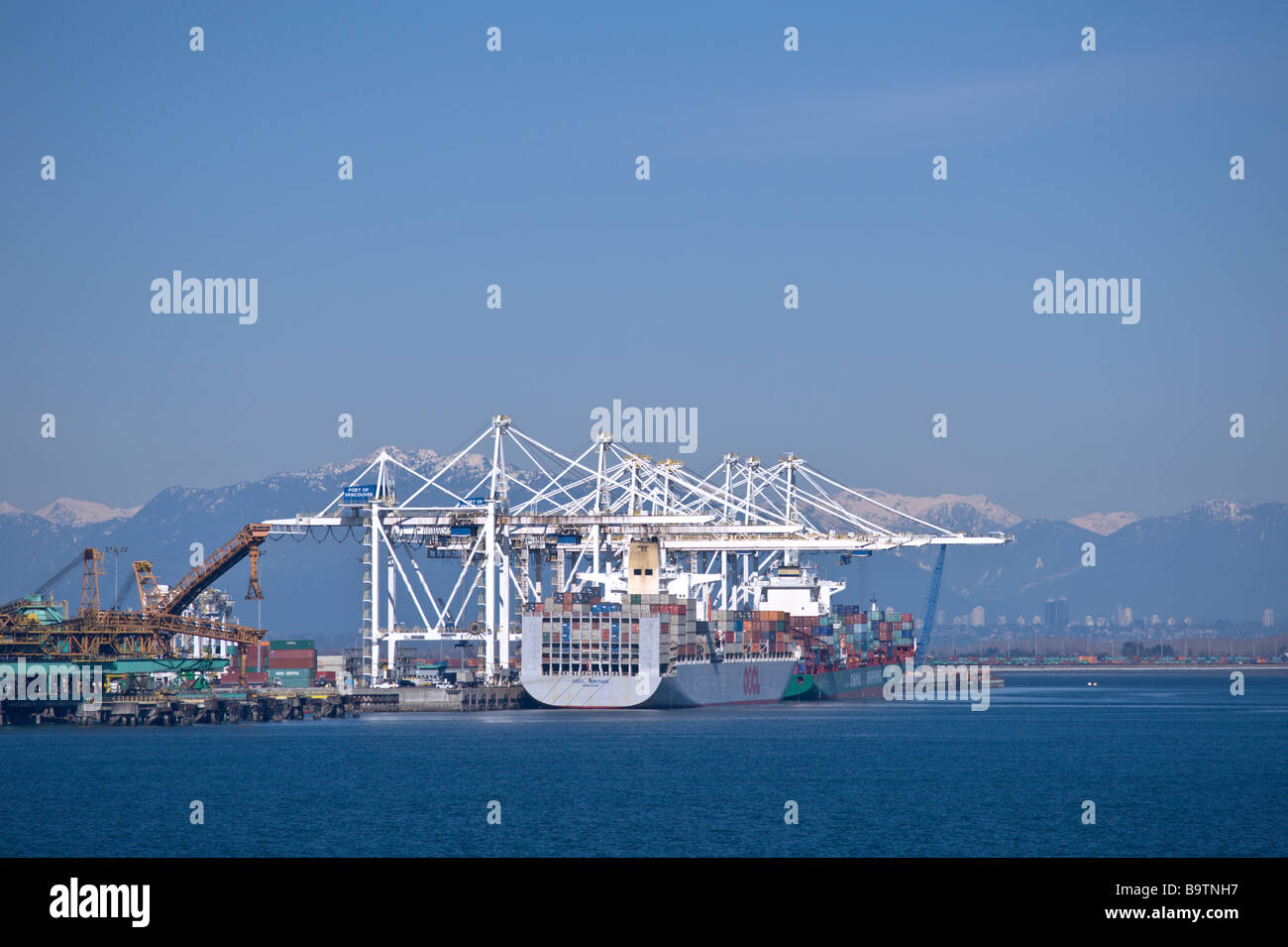 Port of Vancouver or Port Metro Vancouver at Roberts Bank Superport or Deltaport at Delta with coal and container ships Stock Photo