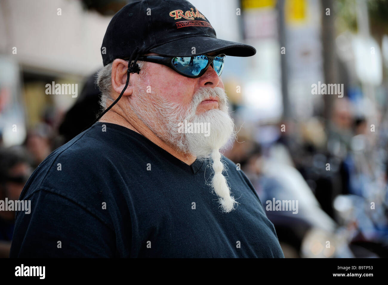 Portrait Senior male sunglasses white beard wearing hat Stock Photo