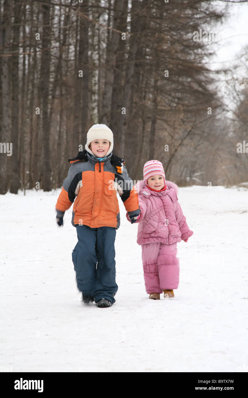 brother and sister walk in park in winter Stock Photo - Alamy