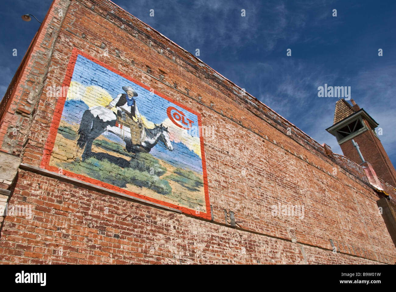 Colorado Cripple Creek historic gold mining town wall mural art on red brick building Stock Photo