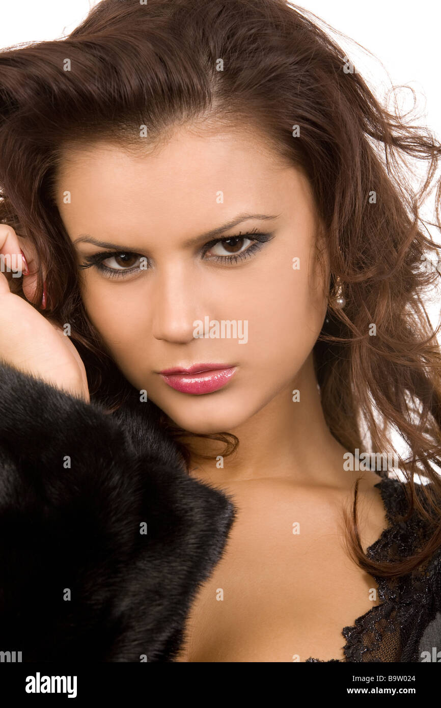 young woman in fur coat on white background Stock Photo - Alamy