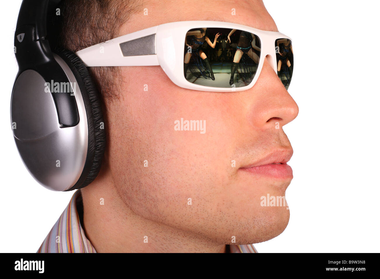 Young man with sunglasses and headphones half-turned. my picture on glasses Stock Photo