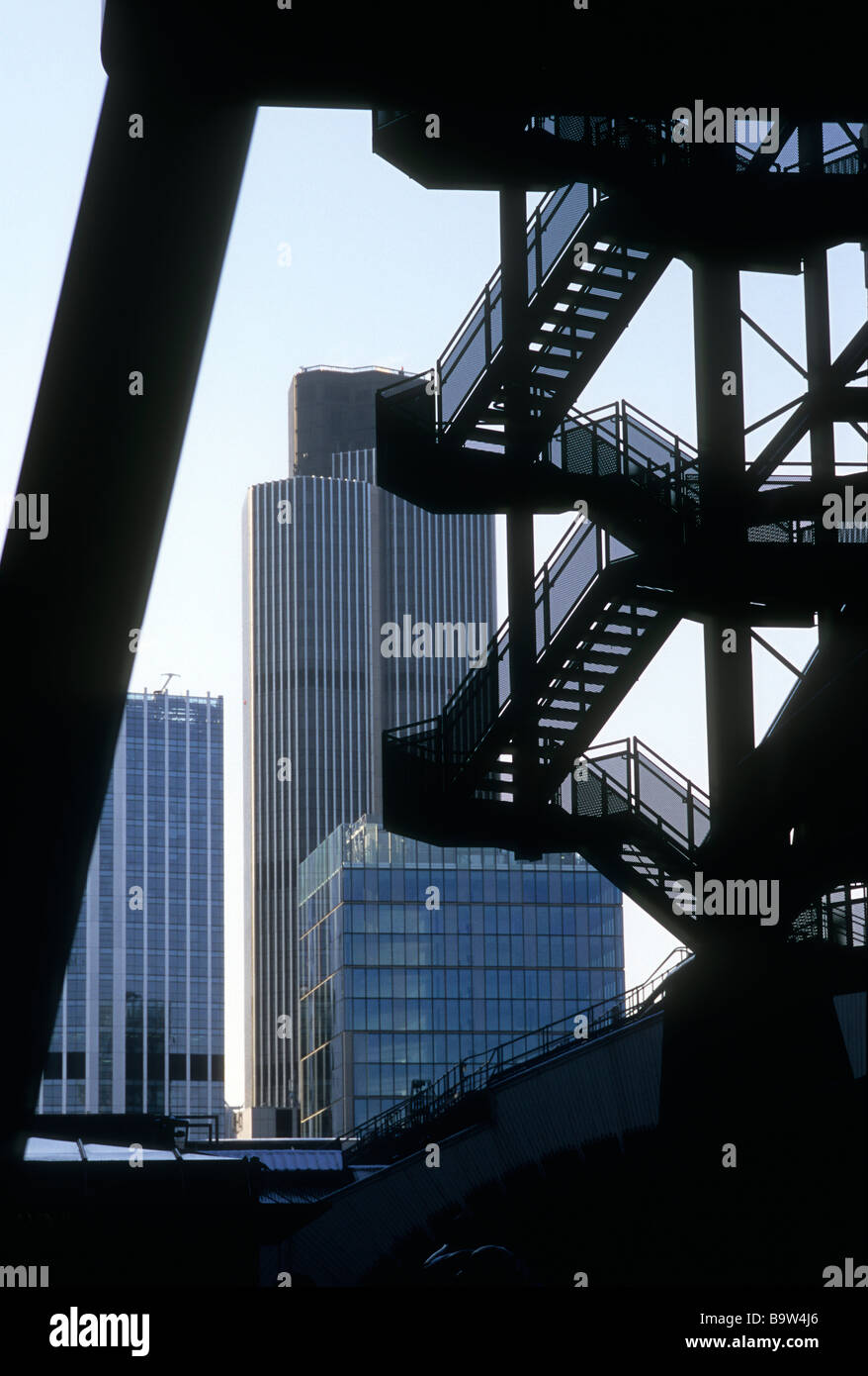 Tower 42 (NatWest tower) behind silhouette of staircase Stock Photo